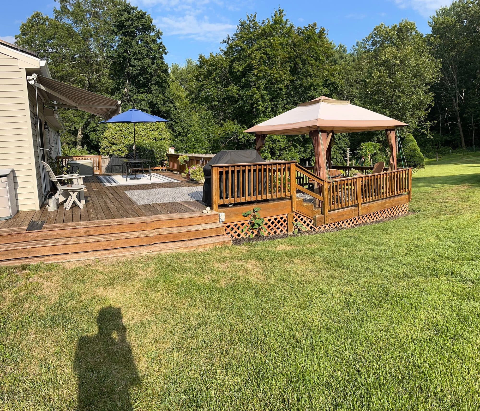Composite deck with a gazebo behind a Central Connecticut home