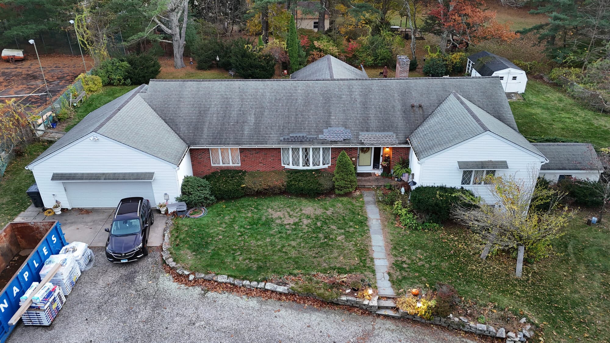 Aerial view of a finished red-brick ranch home in Central Connecticut